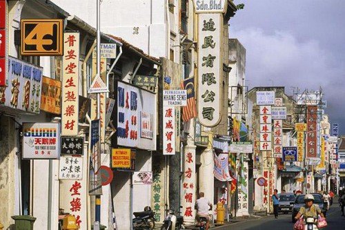 Old shophouses along a busy street in George Town, Penang (Photo from Telegraph UK)