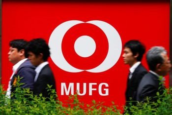 People walking past a MUFG branch in Tokyo (Photo from The Star)