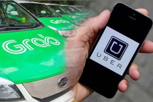Ride-sharing, e-hailing services Grab and Uber